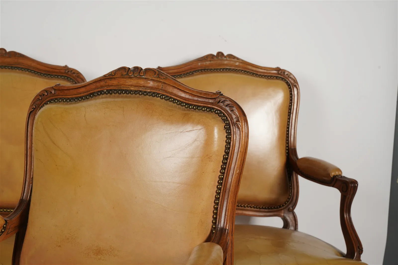 AF2-036: Antique Pair of Late 20th Century French Provincial Fruitwood Fauteuils w/ Leather Upholstery