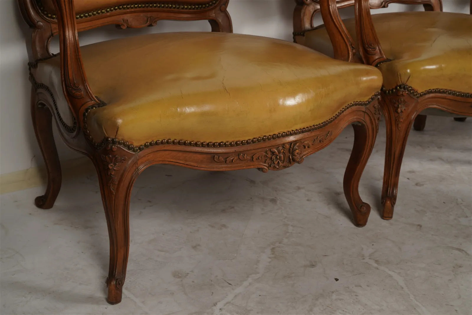 AF2-036: Antique Pair of Late 20th Century French Provincial Fruitwood Fauteuils w/ Leather Upholstery