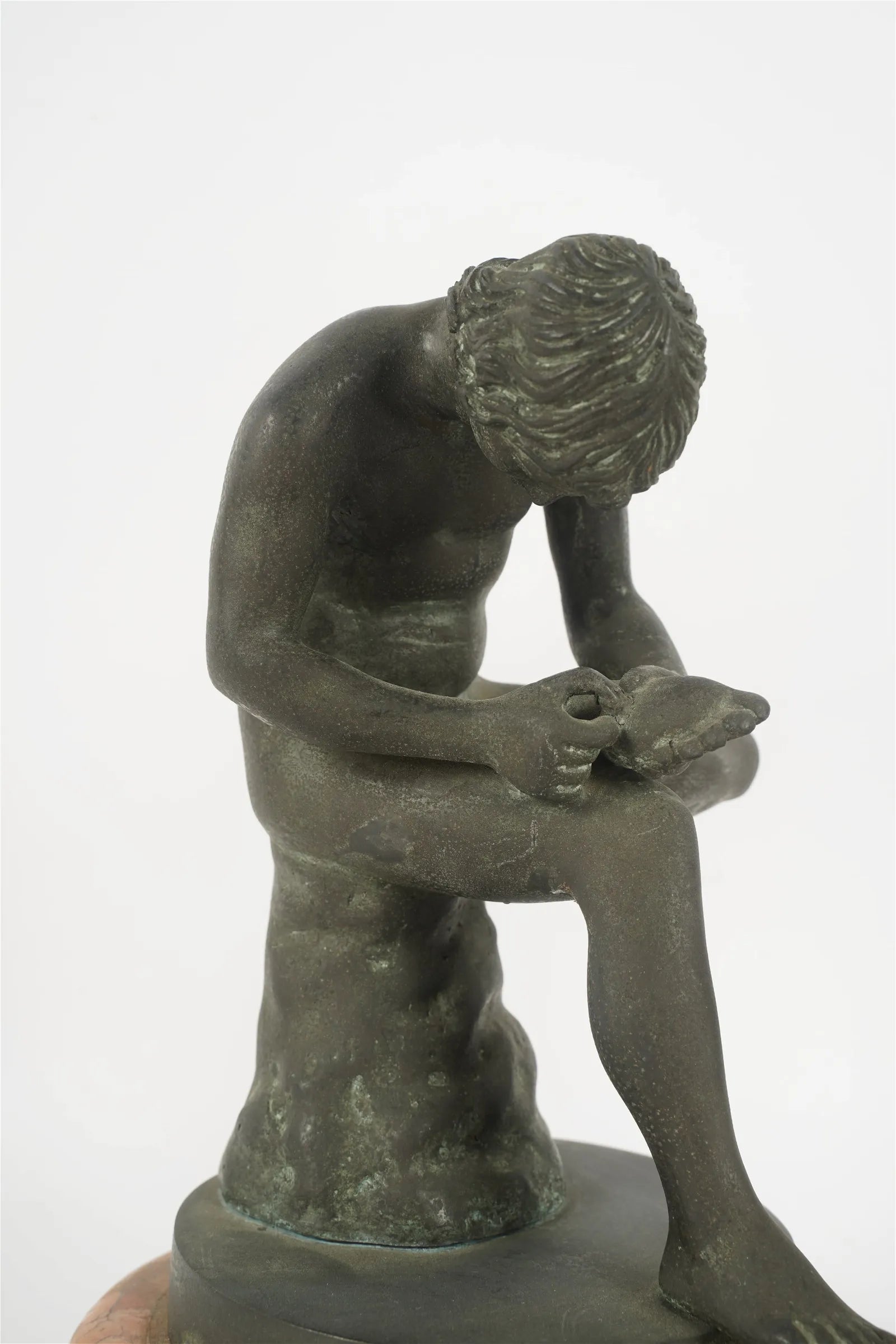 AW11-021: Late 19th Century Grand Tour Patinated Bronze Figure of Boy With Thorn - Seated Male Nude After Greco Roman Antiquity