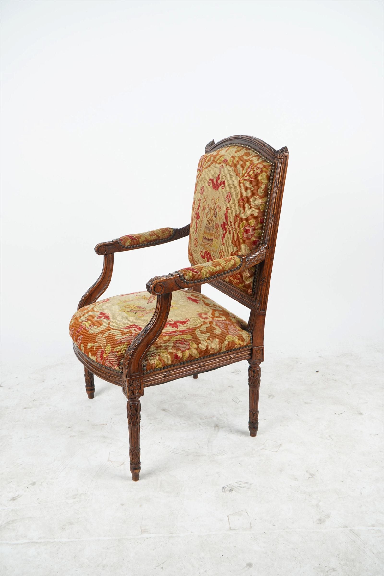 AF2-012: ANTIQUE LATE 19TH CENTURY FRENCH LOUIS XVI STYLE CARVED WALNUT FAUTEUIL