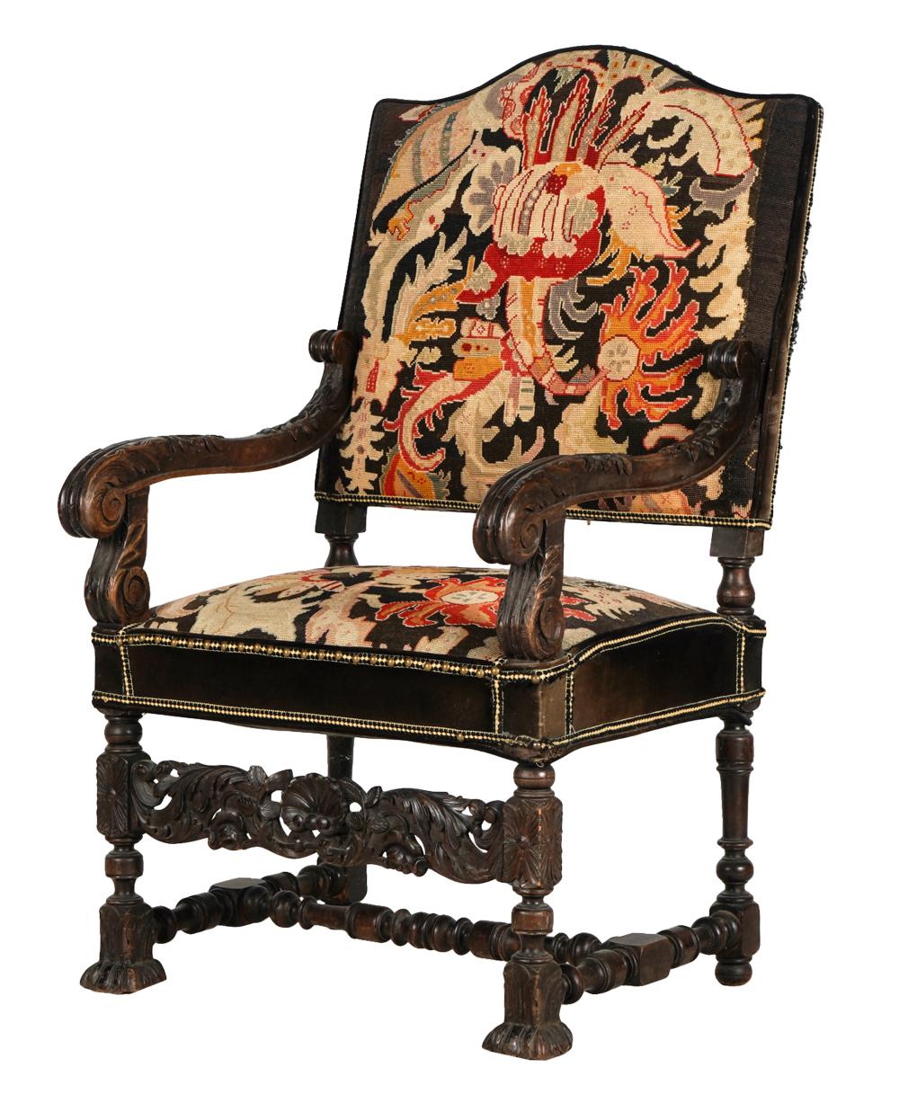 AF2-035: ANTIQUE LATE 19TH CENTURY SPANISH COLONIAL REVIVAL CARVED ARMCHAIR WITH NEEDLEPOINT UPHOLSTERY