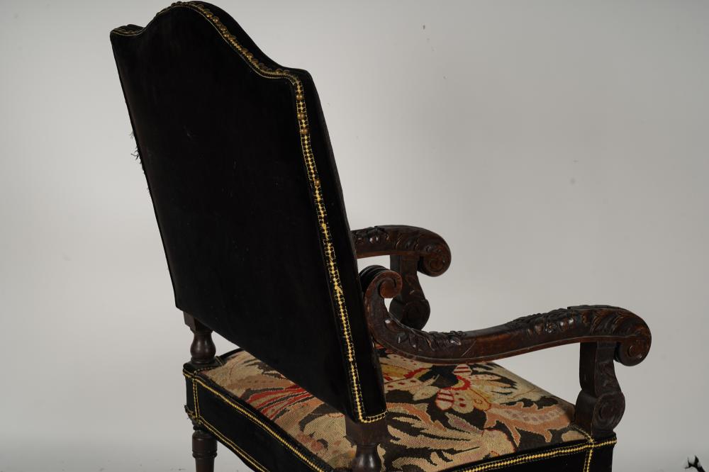 AF2-035: ANTIQUE LATE 19TH CENTURY SPANISH COLONIAL REVIVAL CARVED ARMCHAIR WITH NEEDLEPOINT UPHOLSTERY