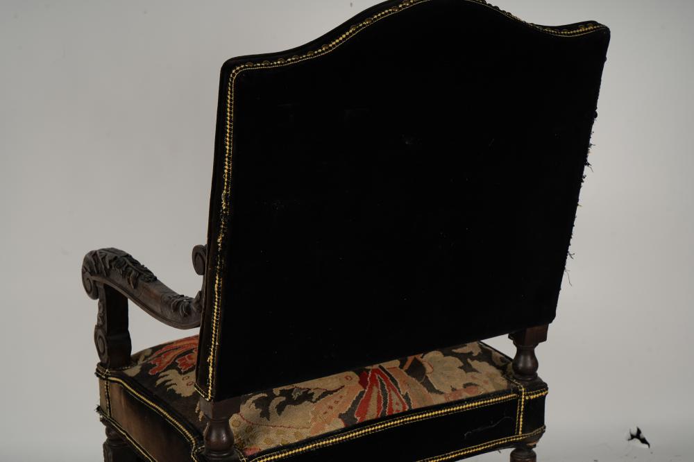 AF2-035: ANTIQUE LATE 19TH CENTURY SPANISH COLONIAL REVIVAL CARVED ARMCHAIR WITH NEEDLEPOINT UPHOLSTERY