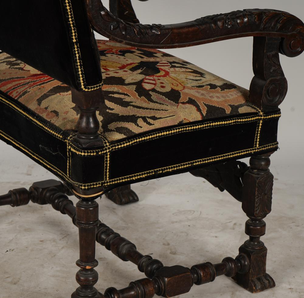 AF2-035: ANTIQUE LATE 19TH CENTURY SPANISH COLONIAL REVIVAL CARVED ARMCHAIR WITH NEEDLEPOINT UPHOLSTERY