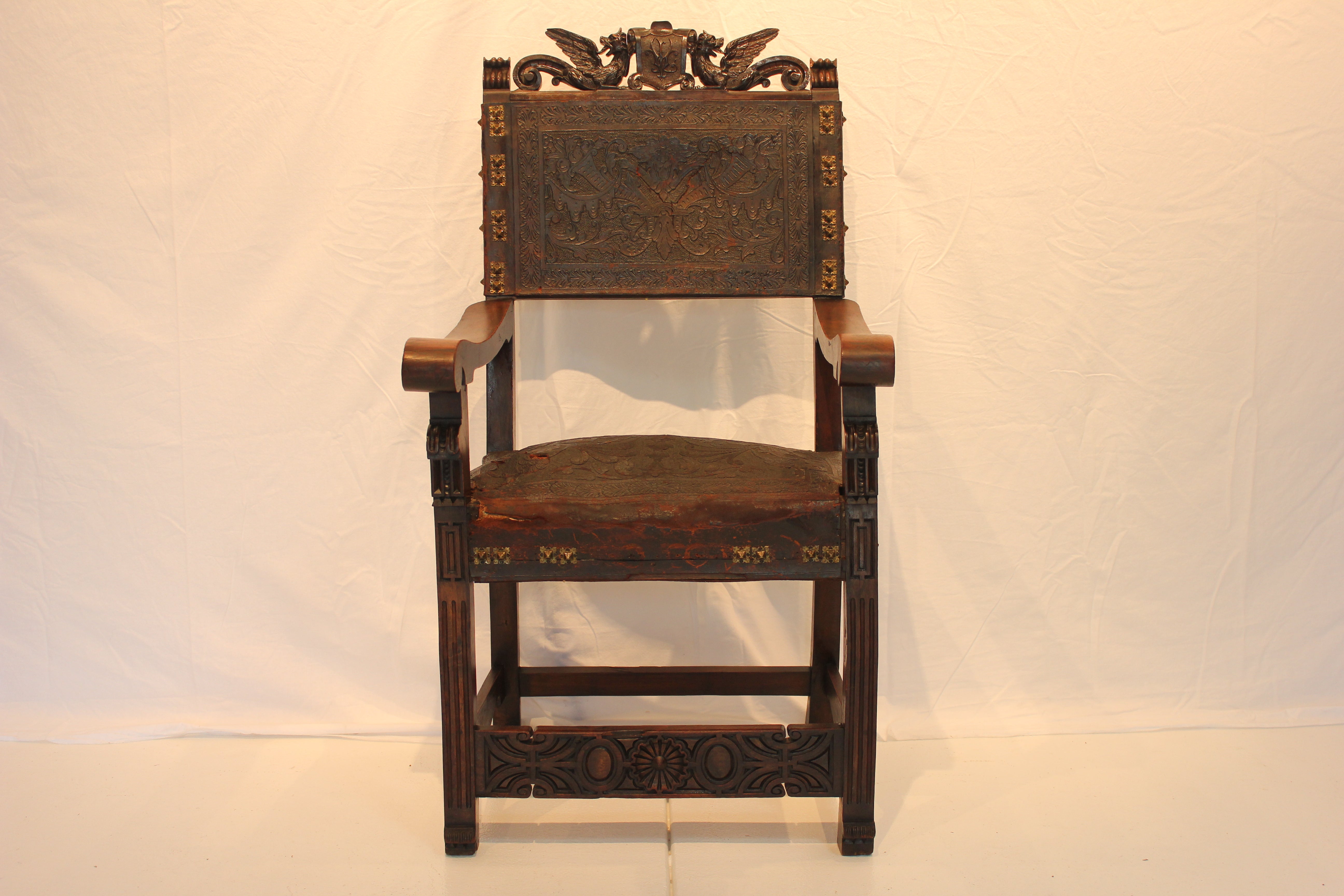 AF2-318: Antique Late 19th Century Highly Carved Walnut Spanish Colonial Arm Chair with Tooled Leather Upholstery