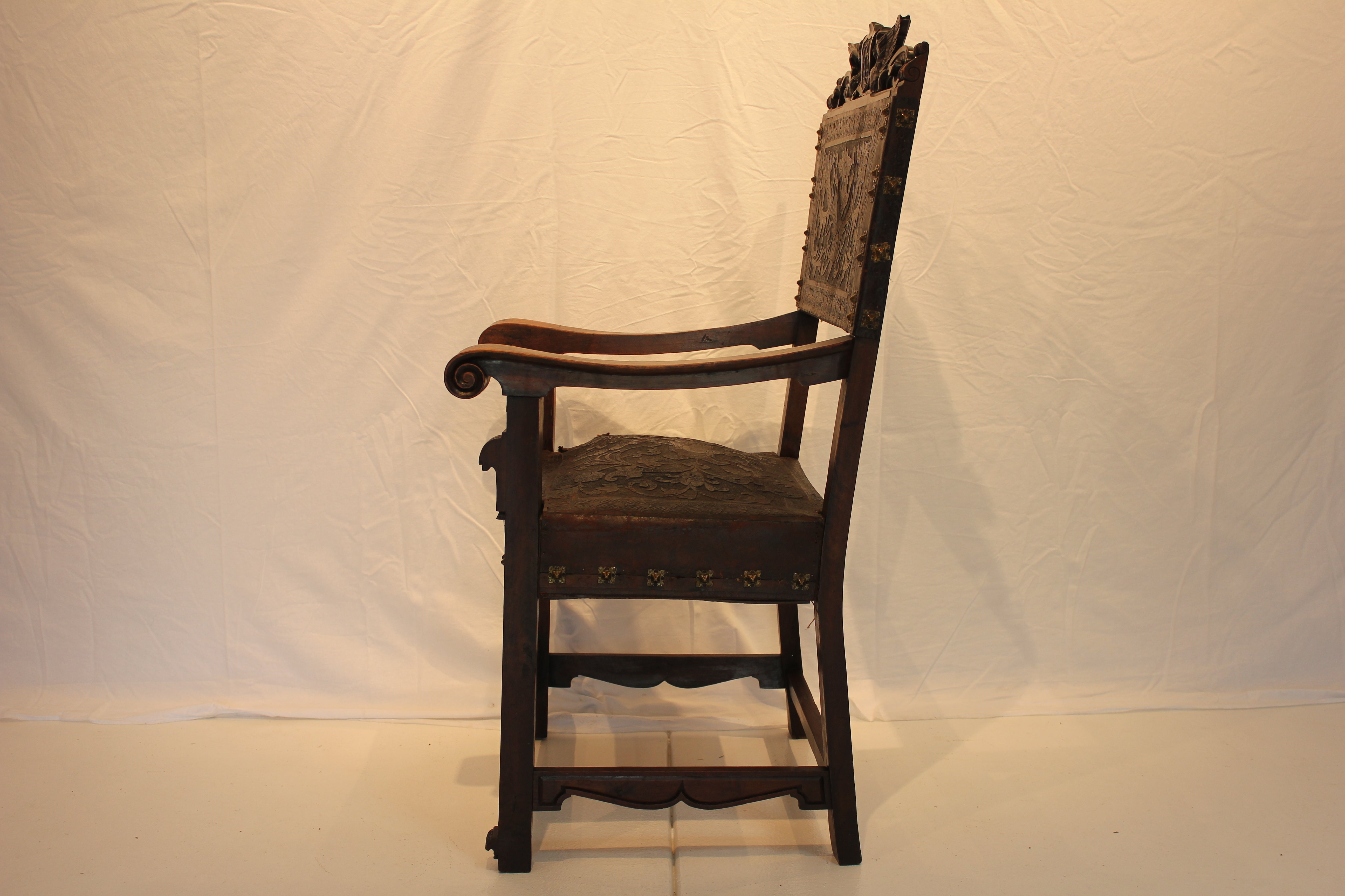 AF2-318: Antique Late 19th Century Highly Carved Walnut Spanish Colonial Arm Chair with Tooled Leather Upholstery