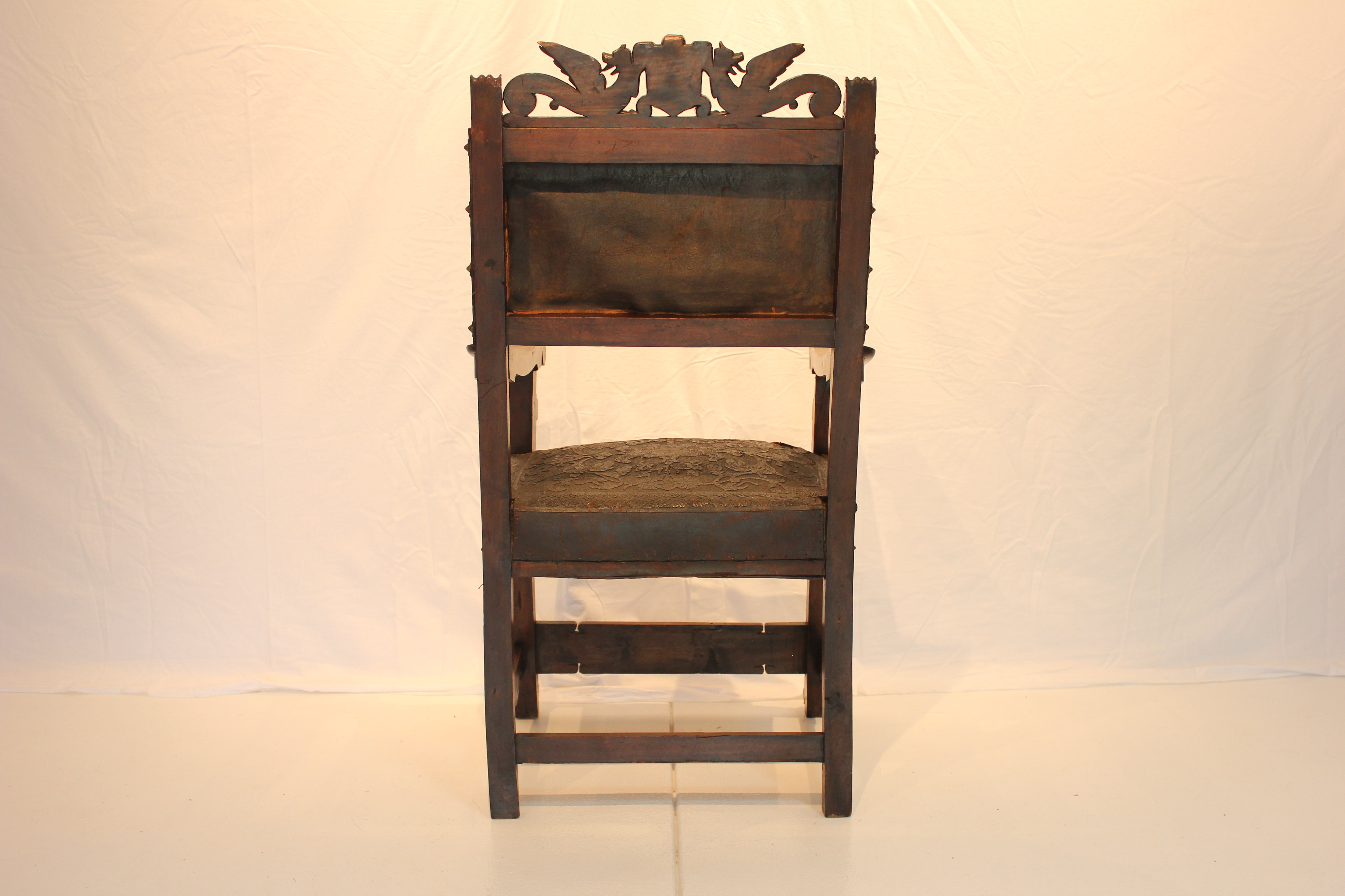 AF2-318: Antique Late 19th Century Highly Carved Walnut Spanish Colonial Arm Chair with Tooled Leather Upholstery