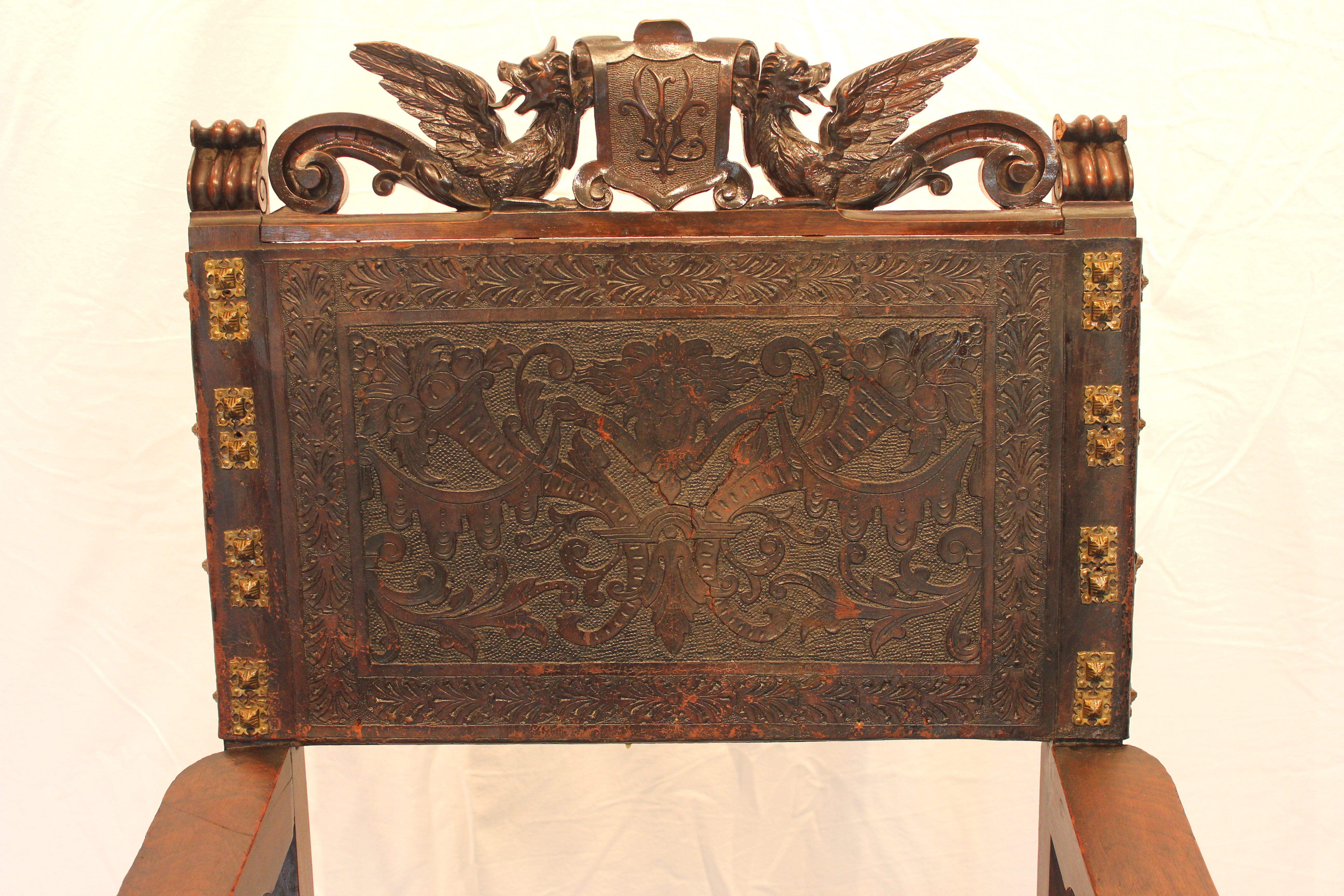 AF2-318: Antique Late 19th Century Highly Carved Walnut Spanish Colonial Arm Chair with Tooled Leather Upholstery